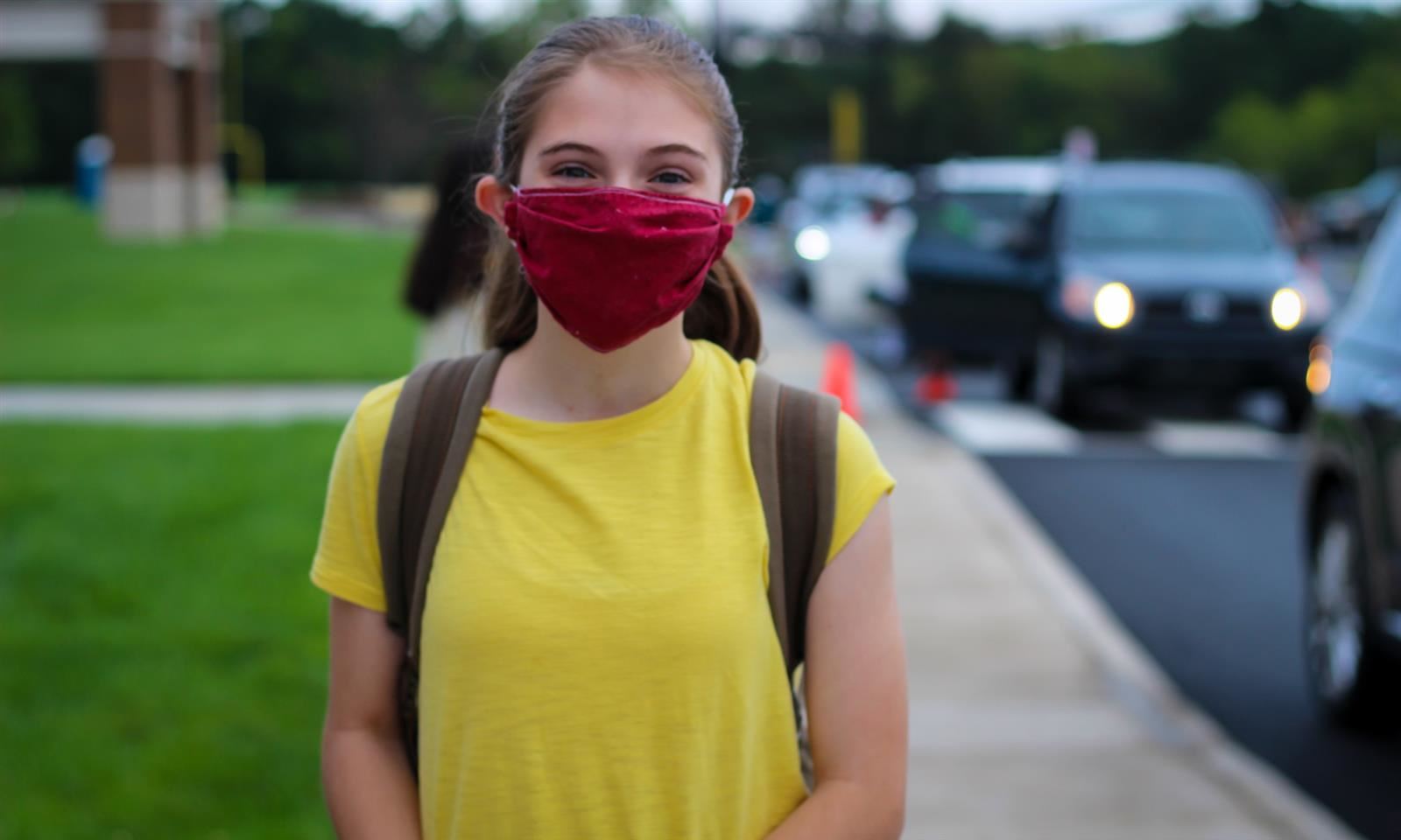Girl standing outside of school 